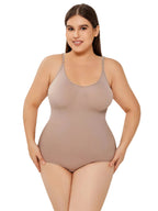 Woman wearing a beige bodysuit against a plain background
